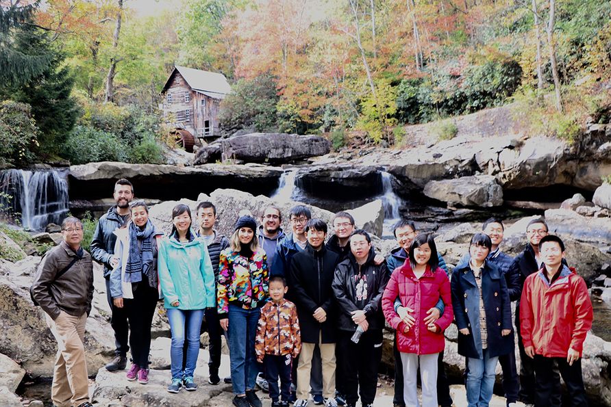 1.	Late West Virginia University Professor Yi Luo (far left) often organized off-campus activities for mining engineering graduate students, visiting scholars and their families, including a spring trip to Babcock State Park in Clifftop, West Virginia.
