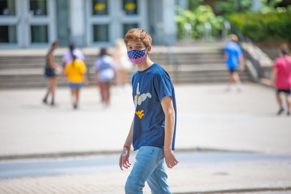 A WVU student wears a mask while on campus.