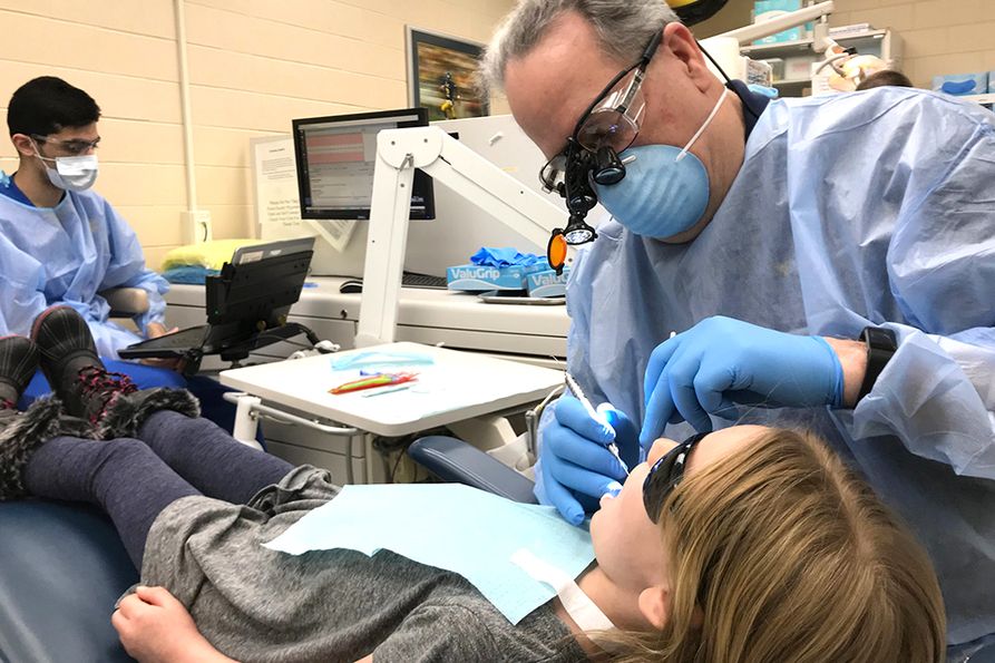 WVU School of Dentistry providers treat a patient in the pediatric clinic for Give Kids a Smile Day in 2020. The School is upgrading and expanding the facility in preparation for a new residency program.