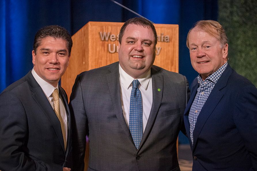 (L to R): Javier Reyes, WVU business school dean; Chad Prather, Huntington Bank’s regional president for West Virginia; John Chambers, former Cisco Chairman and CEO, and WVU alumnus and for whom the business school was name