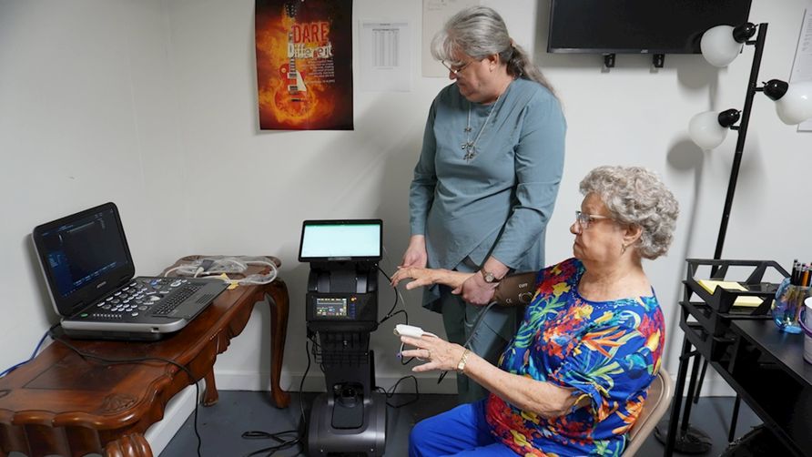 Faith Community Nurse Melissa Coleman works with a patient during a telehealth appointment at Bradshaw Church of God.  