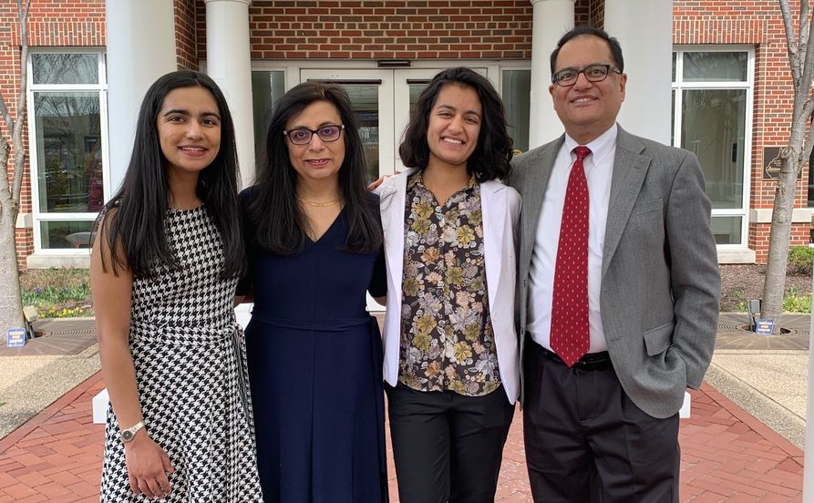 Sundus Lateef (from left) poses with mother Atiya, sister Soofia and father Khalid Lateef at WVU’s Erickson Alumni Center.