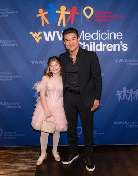 Entertainer Mario Lopez, emcee for the 2024 WVU Medicine Children’s Gala, poses with Addison Schrock, the 2024 Children’s Miracle Network Hospitals® Champion Child.