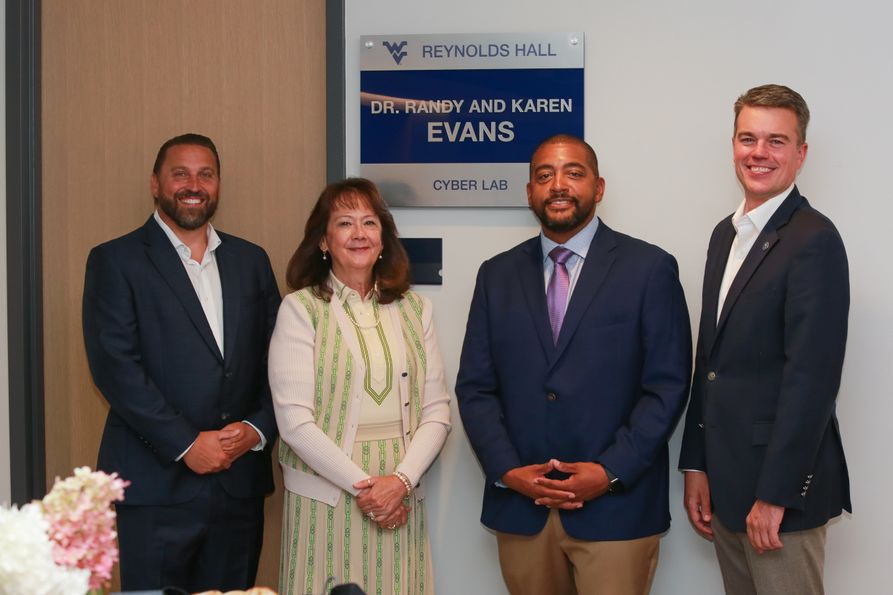 Pictured (L-R): Randy Cottle, Trilogy Vice President and COO; Karen Evans, national cybersecurity expert and who named the lab with her husband, Dr. Randy Evans; Trilogy President and CEO Brandon Downey; and Josh Hall, dean of the Chambers Colleg