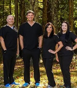 Dr. Travis Wills (far left) and his colleagues at Shady Spring Dental Care – (from left) Dr. Ben Hiener, Dr. Kristie Hiener and Dr. Skylar Poe – agreed to donate the equivalent of one filling per month for the next five years to support the WVU School of 
