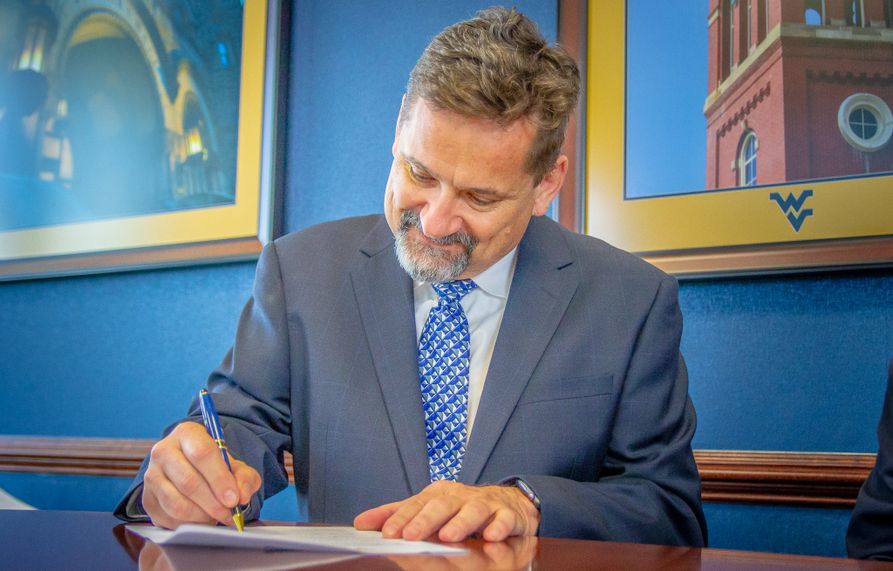Asphalt Pavement Association of West Virginia Executive Director Pat Parsons signs a gift agreement to fund an endowed faculty chair at the Statler College of Engineering and Mineral Resources.