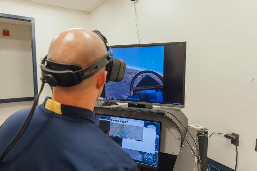 Jason Gross, interim chair of the Department of Mechanical and Aerospace Engineering and associate professor, uses a mixed-reality flight simulation tool donated to WVU’s Benjamin M. Statler College of Engineering and Mineral Resources by MVRsimulation.