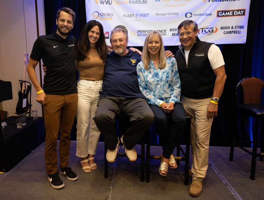 2.	Bob Huggins (center) poses with Huggins Homecoming sponsors Frank and Stacey DeJulius (from left) and Linda and Pete Zulia.